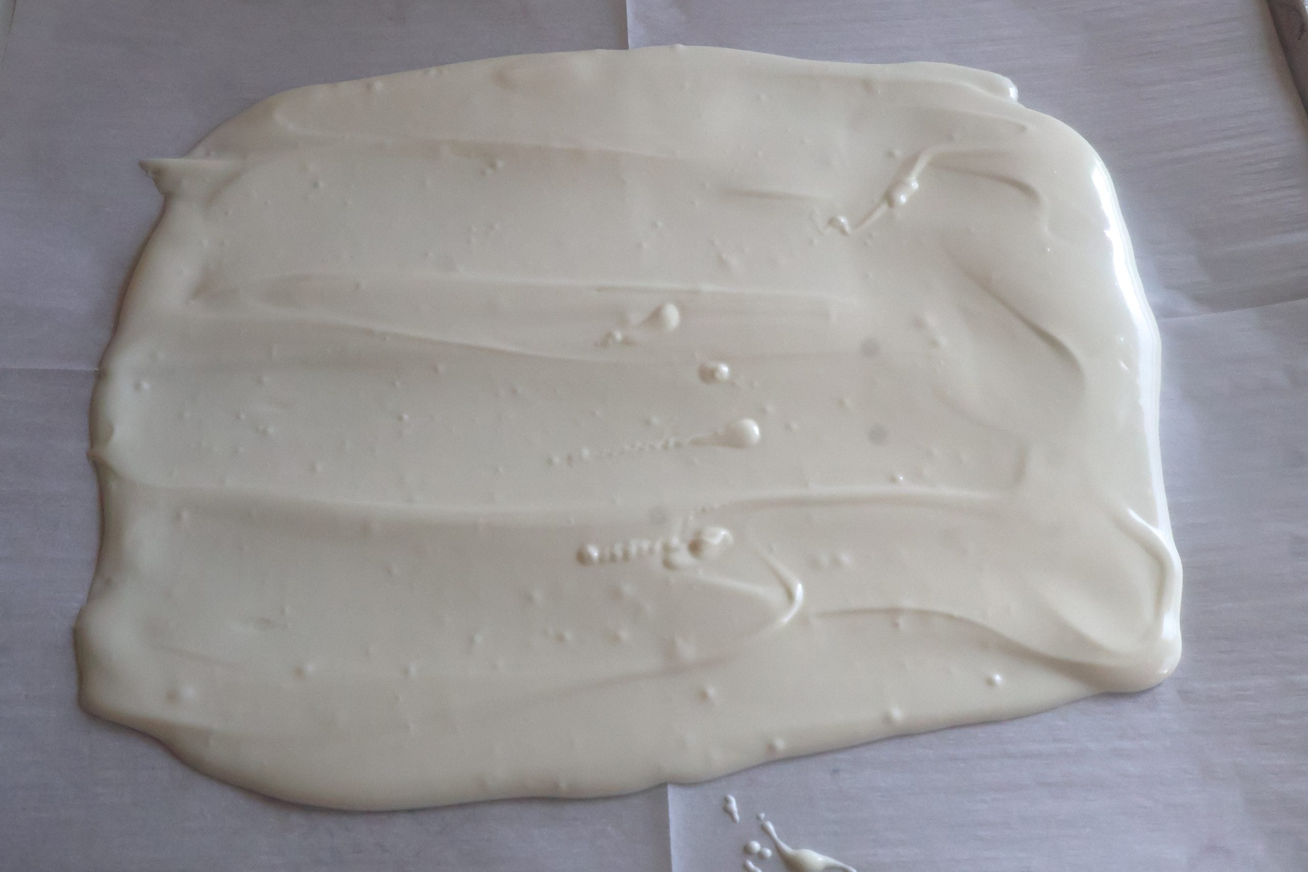white choclate spread on parchment paper.
