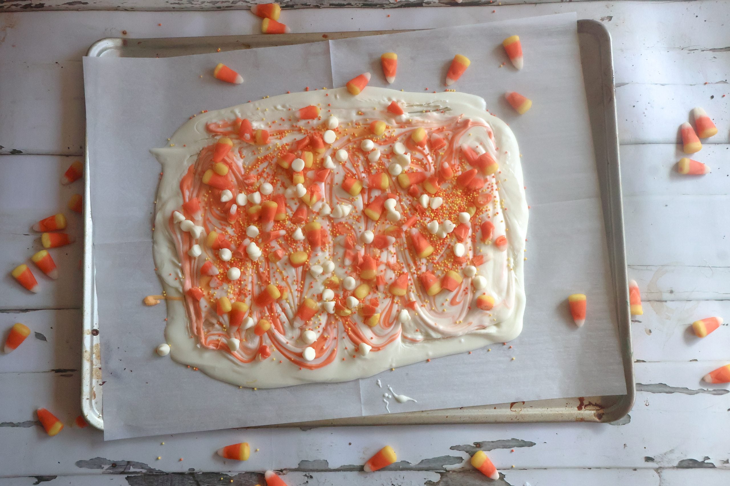 finished candy corn bark on a sheet pan.