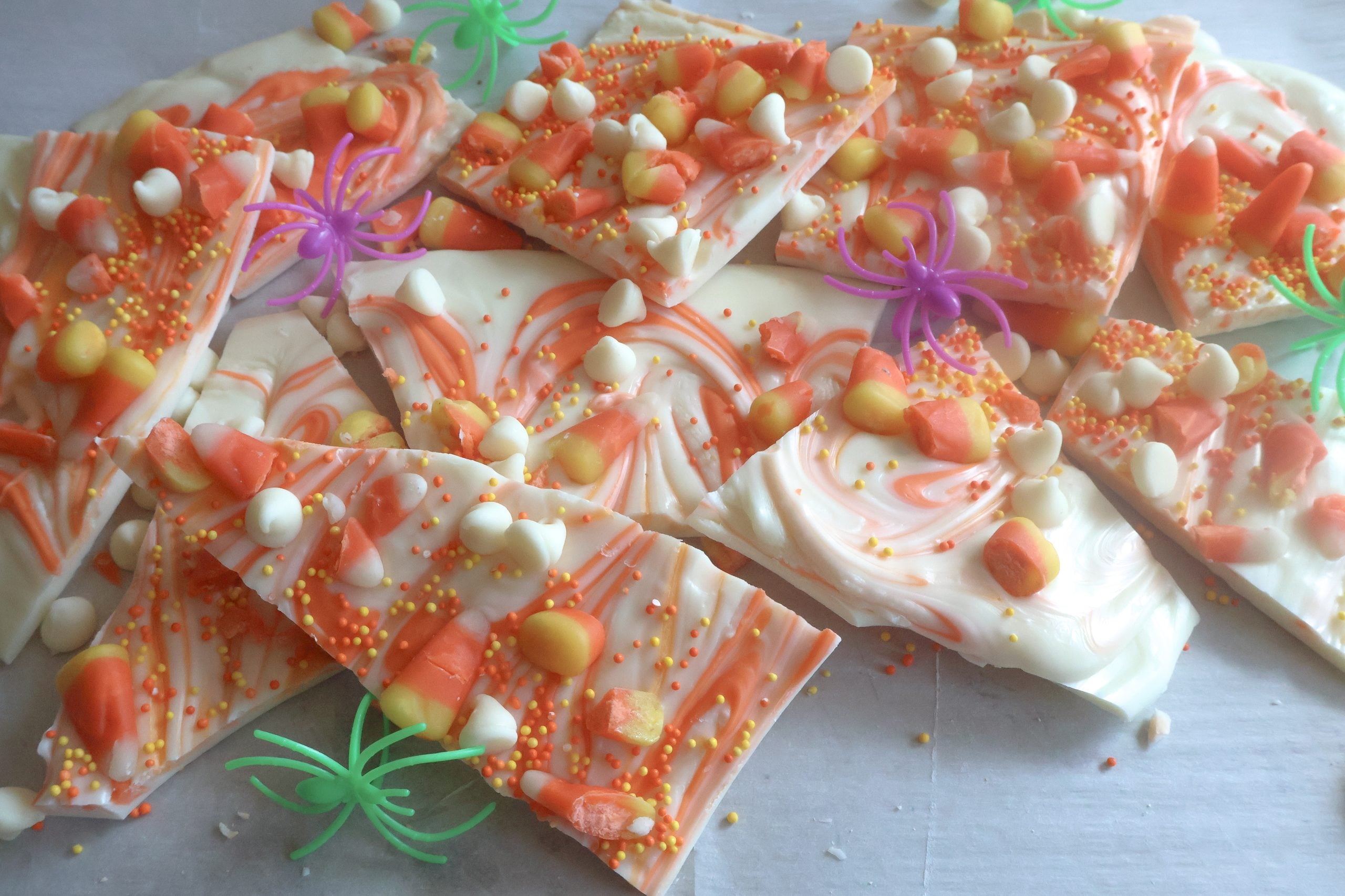 candy corn bark with purple and green spiders.